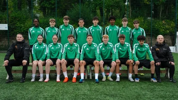 Ashfield College Transition Year football students and coaches posing for a team photo on the pitch