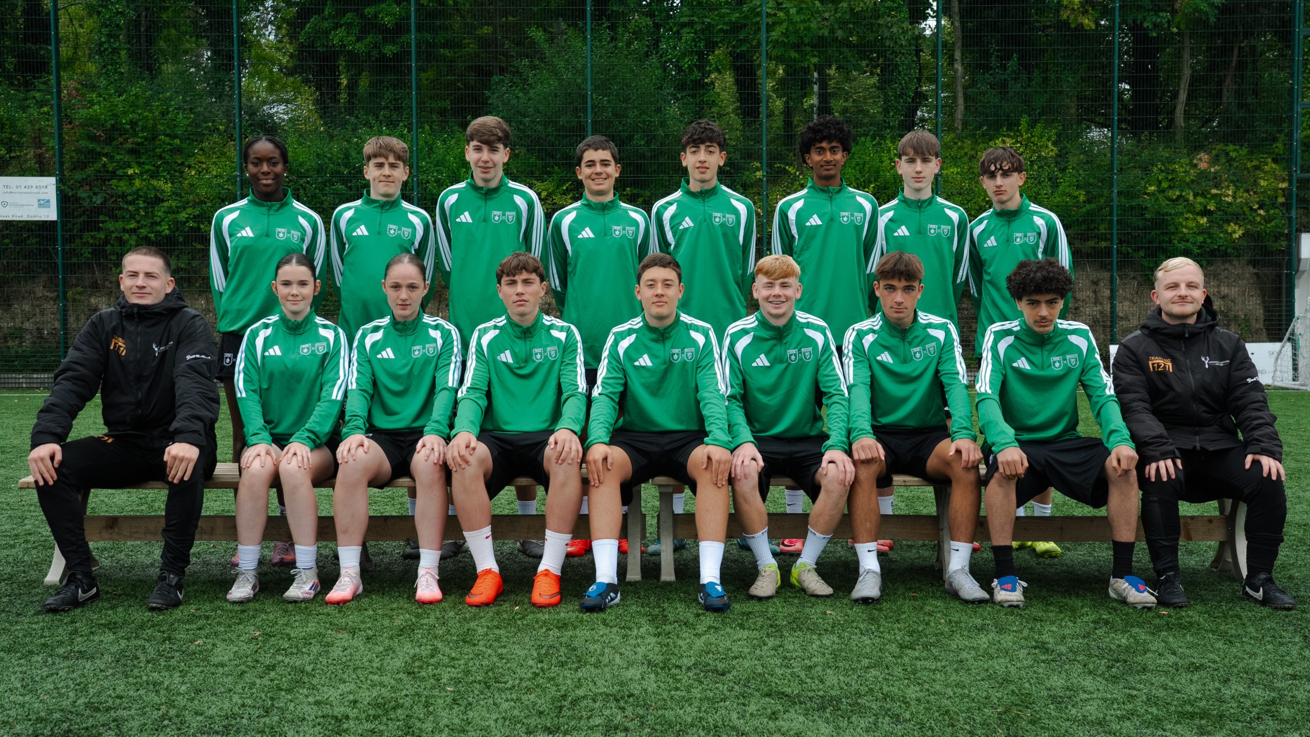 Ashfield College Transition Year football students and coaches posing for a team photo on the pitch